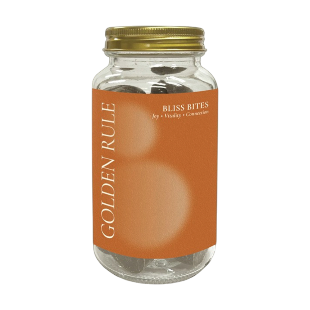 Glass jar of Golden Rule Bliss Bites chocolate hearts with an orange label