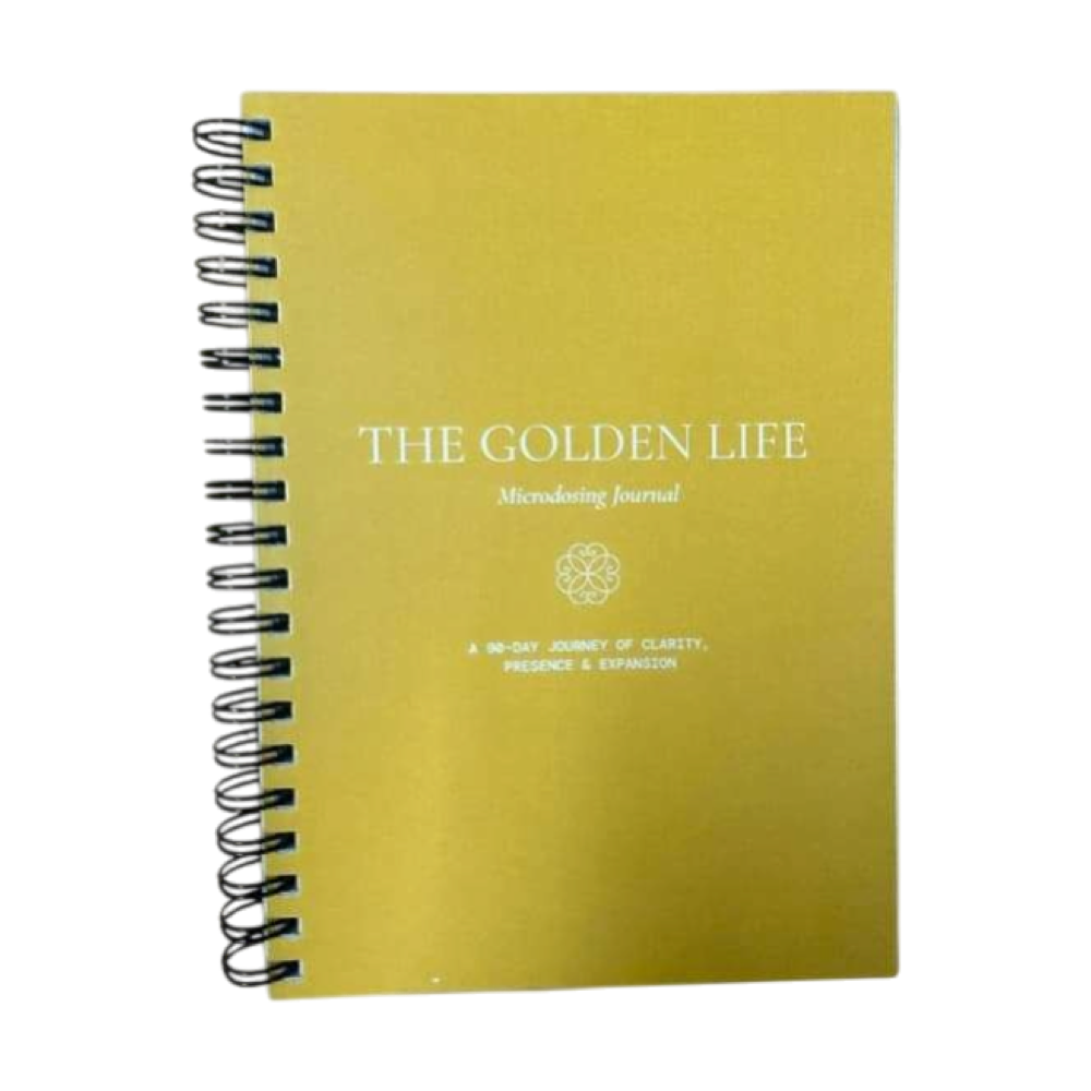 The Golden Life 90-day microdosing journal with a gold spiral-bound cover